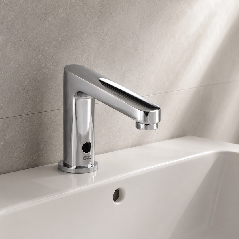 Durable touchless faucet in a commercial restroom with temperature memory feature