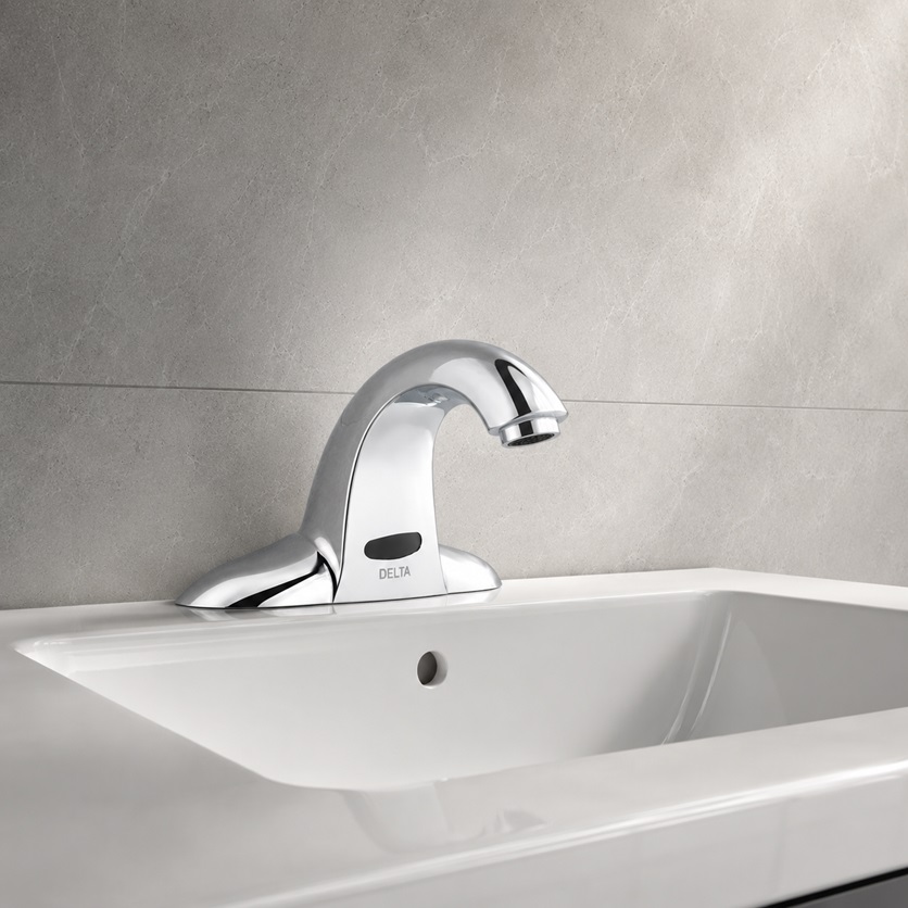Touch and motion activated faucet on a modern kitchen sink with flexible control
